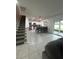 Spacious kitchen with stainless steel appliances, center island, and open floor plan at 293 Fiddlewood Ct, Davenport, FL 33837