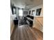 Cozy living room features stylish decor, a comfortable sectional sofa, and wood-look flooring at 293 Fiddlewood Ct, Davenport, FL 33837