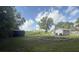 A spacious backyard features a firepit with ample room for activities and outdoor enjoyment at 3050 Old Soldier Rd, Lakeland, FL 33810