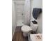 Compact bathroom featuring a walk-in shower, white toilet, and a towel rack at 3050 Old Soldier Rd, Lakeland, FL 33810