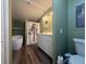 Bathroom featuring standalone soaking tub, double sink vanity, and toilet at 3050 Old Soldier Rd, Lakeland, FL 33810