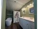 Bathroom featuring tub, double sink vanity, and shower behind decorative curtain at 3050 Old Soldier Rd, Lakeland, FL 33810