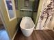 Bathroom featuring standalone soaking tub, and shower behind decorative curtain at 3050 Old Soldier Rd, Lakeland, FL 33810