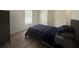 Bedroom featuring wood-look floors, neutral walls and a large window at 3050 Old Soldier Rd, Lakeland, FL 33810