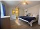 Bedroom featuring wood-look floors and view of bathroom at 3050 Old Soldier Rd, Lakeland, FL 33810