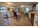 Eat-in kitchen and dining area with wood laminate flooring at 3050 Old Soldier Rd, Lakeland, FL 33810