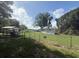 View of fenced in yard and home exterior with shed in background at 3050 Old Soldier Rd, Lakeland, FL 33810
