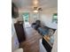 Relaxing living area boasting an exterior door to the back deck with a tv and a small table at 3050 Old Soldier Rd, Lakeland, FL 33810
