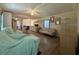 Open-concept living room with ceiling fan, wood laminate floors and neutral decor at 3050 Old Soldier Rd, Lakeland, FL 33810