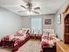 Comfortable bedroom with two twin beds, side tables, and decorative accents at 3158 Forest Breeze Way, St Cloud, FL 34771