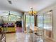 Bright dining area with pool views and adjacent living space, perfect for Gathering meals at 3158 Forest Breeze Way, St Cloud, FL 34771