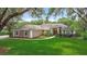 Inviting single-story home with a well-manicured lawn and a charming walkway to the front door at 3158 Forest Breeze Way, St Cloud, FL 34771