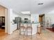 Kitchen featuring a breakfast bar with barstools, stainless steel appliances, and ample counter space at 3158 Forest Breeze Way, St Cloud, FL 34771