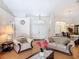 Inviting living room featuring a light interior, hardwood floors, and a clear view into the dining area at 3158 Forest Breeze Way, St Cloud, FL 34771