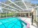 Inviting screened-in pool with clear water and patio area perfect for entertaining at 3158 Forest Breeze Way, St Cloud, FL 34771