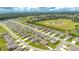 An aerial view of a residential community with ballfields and a lake in the background at 31792 Broadwater Ave, Leesburg, FL 34748