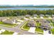 Aerial view of a suburban neighborhood with homes near a lake, showcasing a planned community at 31792 Broadwater Ave, Leesburg, FL 34748