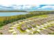 Overhead aerial view of a sprawling neighborhood with homes nestled near a scenic lake at 31792 Broadwater Ave, Leesburg, FL 34748