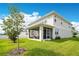 The backyard of this home features a screened-in porch and well-maintained lawn at 31792 Broadwater Ave, Leesburg, FL 34748