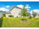 Spacious backyard with green lawn and lush landscaping at 31792 Broadwater Ave, Leesburg, FL 34748