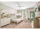 Comfortable bedroom features a ceiling fan, bunk beds, a decorative screen and ensuite at 31792 Broadwater Ave, Leesburg, FL 34748