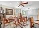 Charming living room with hardwood floors, curtains, a ceiling fan, and seating area at 31792 Broadwater Ave, Leesburg, FL 34748