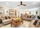 Open living room showcasing ample seating and decor flowing seamlessly to the kitchen at 31792 Broadwater Ave, Leesburg, FL 34748