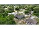 Aerial view of a well-kept home and yard in a residential neighborhood setting at 3390 George Sauls St, Deltona, FL 32738