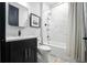 Bathroom featuring modern fixtures, tiled walls, and a shower-tub combination at 3390 George Sauls St, Deltona, FL 32738