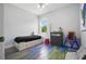 Bright bedroom with colorful painted wood floor and a window providing natural light at 3390 George Sauls St, Deltona, FL 32738