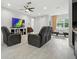 Bright and spacious living room with luxury vinyl plank flooring, comfortable seating, and modern decor at 3390 George Sauls St, Deltona, FL 32738