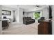Open-concept living area featuring luxury vinyl plank flooring, a comfortable seating area, and dining space at 3390 George Sauls St, Deltona, FL 32738