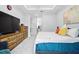 Spacious primary bedroom with tray ceiling, natural light, and ample furniture at 3390 George Sauls St, Deltona, FL 32738