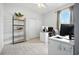 Home office space with large window and shelving, providing functional workspace at 3390 George Sauls St, Deltona, FL 32738