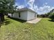 Backyard with patio and well-maintained lawn at 343 Marquee Dr, Kissimmee, FL 34758