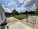 Backyard featuring a paved patio area and a well-maintained lawn at 343 Marquee Dr, Kissimmee, FL 34758
