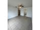 Bedroom featuring tile flooring, ceiling fan and ensuite bathroom at 343 Marquee Dr, Kissimmee, FL 34758