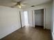 Bedroom featuring tile flooring, ceiling fan and closet at 343 Marquee Dr, Kissimmee, FL 34758