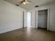 Bedroom featuring tile flooring, ceiling fan and a closet with ample space at 343 Marquee Dr, Kissimmee, FL 34758