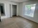 Bedroom with tile flooring, a window, and a closet with ample space at 343 Marquee Dr, Kissimmee, FL 34758