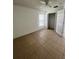 Bedroom featuring tile flooring, closet space, and a window offering natural light at 343 Marquee Dr, Kissimmee, FL 34758