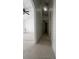 Hallway featuring neutral walls and tile flooring that connects to the living area and bedrooms at 343 Marquee Dr, Kissimmee, FL 34758