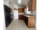 Kitchen featuring wooden cabinetry, stainless steel appliances, and granite countertops at 343 Marquee Dr, Kissimmee, FL 34758