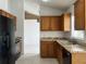 Kitchen featuring wooden cabinetry, stainless steel appliances, and granite countertops at 343 Marquee Dr, Kissimmee, FL 34758