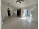 Open-concept living room with tiled floors and sliding glass doors leading to outdoor space at 343 Marquee Dr, Kissimmee, FL 34758