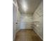 Spacious walk-in closet featuring shelving and tile floor at 343 Marquee Dr, Kissimmee, FL 34758