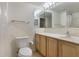 Well-lit bathroom featuring a vanity with cabinets, mirror, sink, and toilet at 364 Fish Hawk Dr, Winter Haven, FL 33884