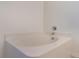 Close-up of a clean, white soaking tub with chrome fixtures at 364 Fish Hawk Dr, Winter Haven, FL 33884