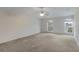 Bright bedroom with neutral carpet, featuring dual windows and a ceiling fan at 364 Fish Hawk Dr, Winter Haven, FL 33884