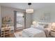 bedroom with charming decor, a desk, a cozy bed and a bright window at 364 Fish Hawk Dr, Winter Haven, FL 33884